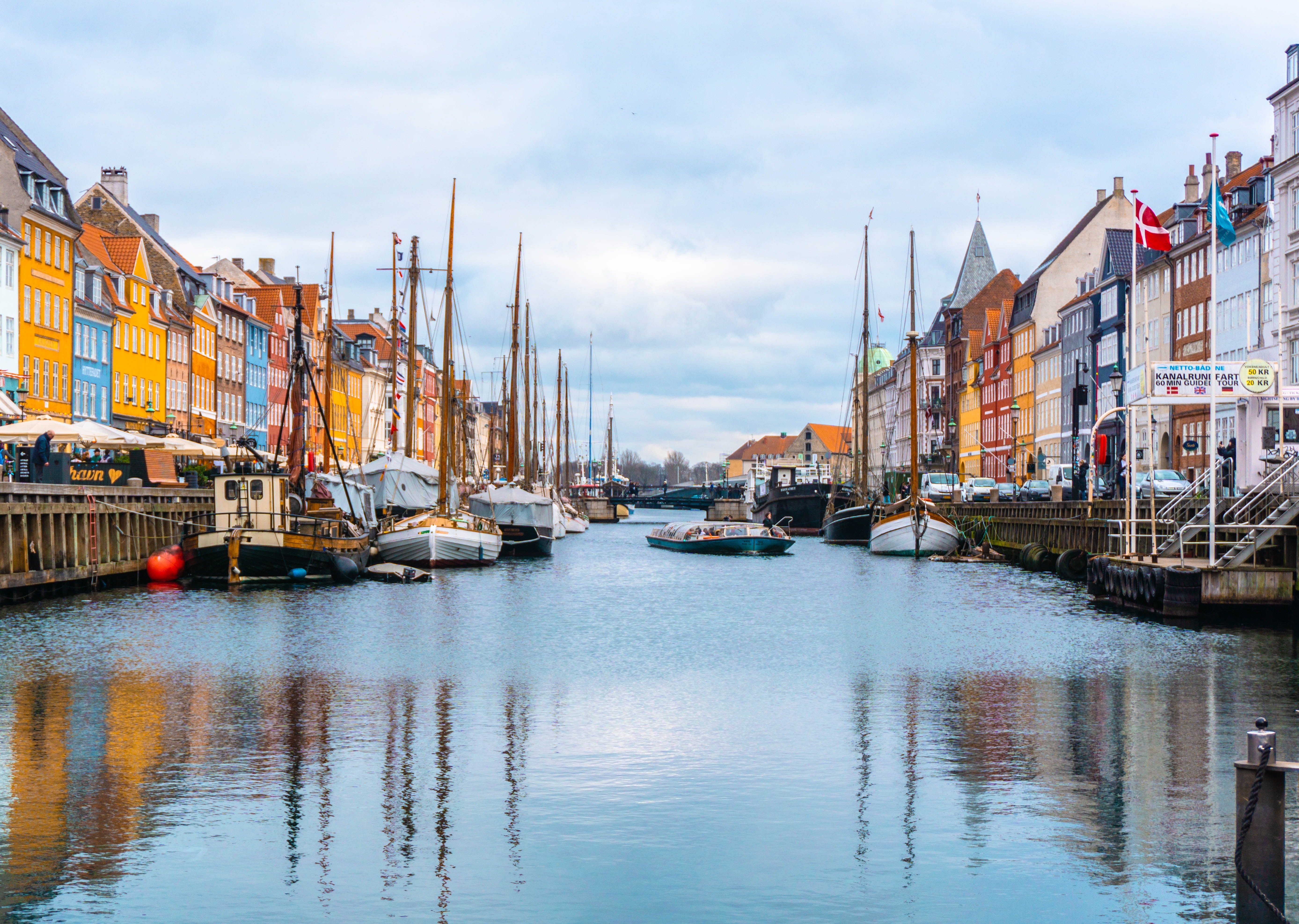 A view of Copenhagen with the waters and boats.