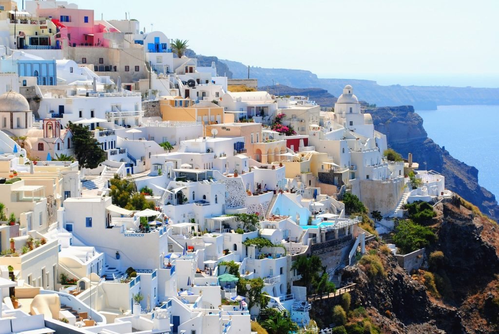 The whitewashed towns on the coast of Santorini are a must on our Greece Travel Guide