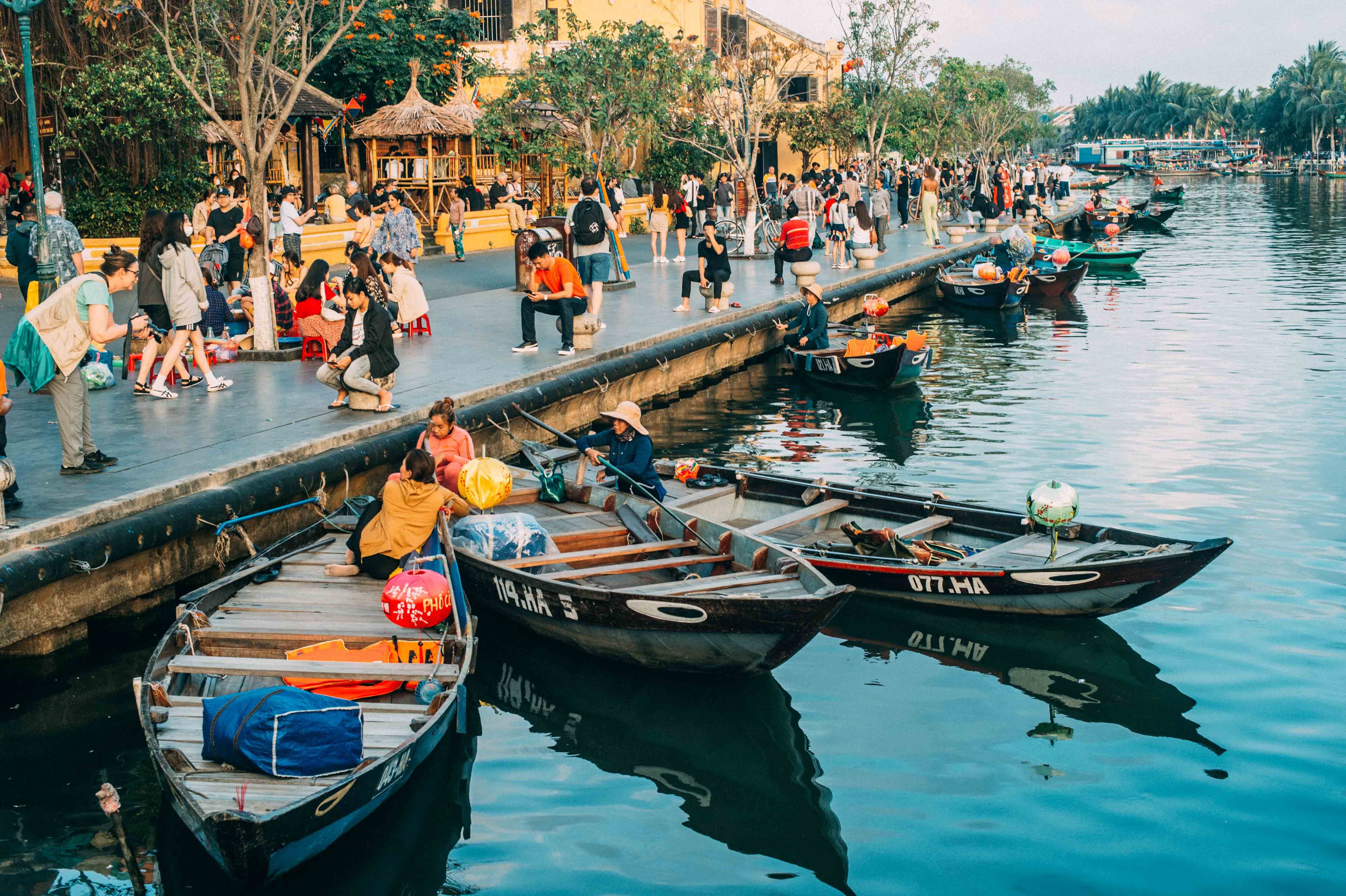 Hoi An, Vietnam with people sitting in boats.