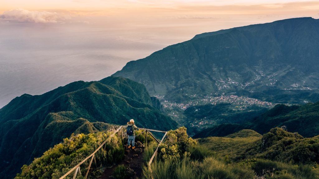 landscape in Madeira, a man looking on to it from a view point