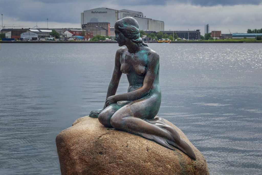 the little mermaid statue in one of the best cities to live in for young professionals in Copenhagen, Denmark.