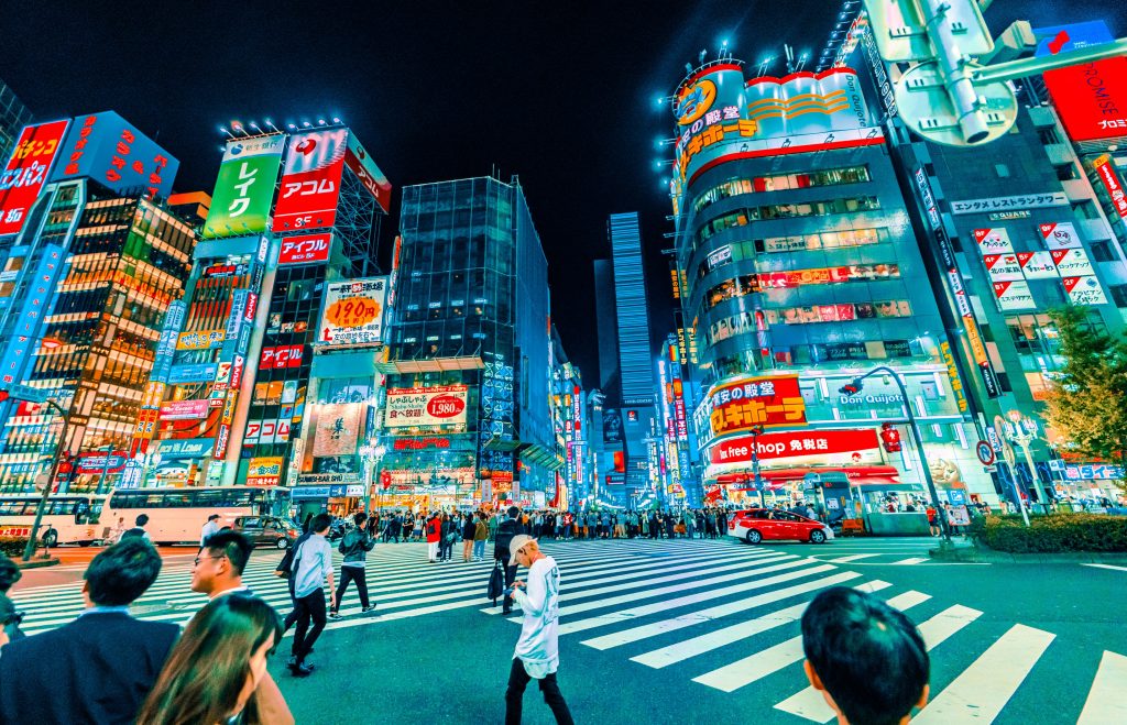 Tokyo city with bright neon lights shining in the evening in Japan.