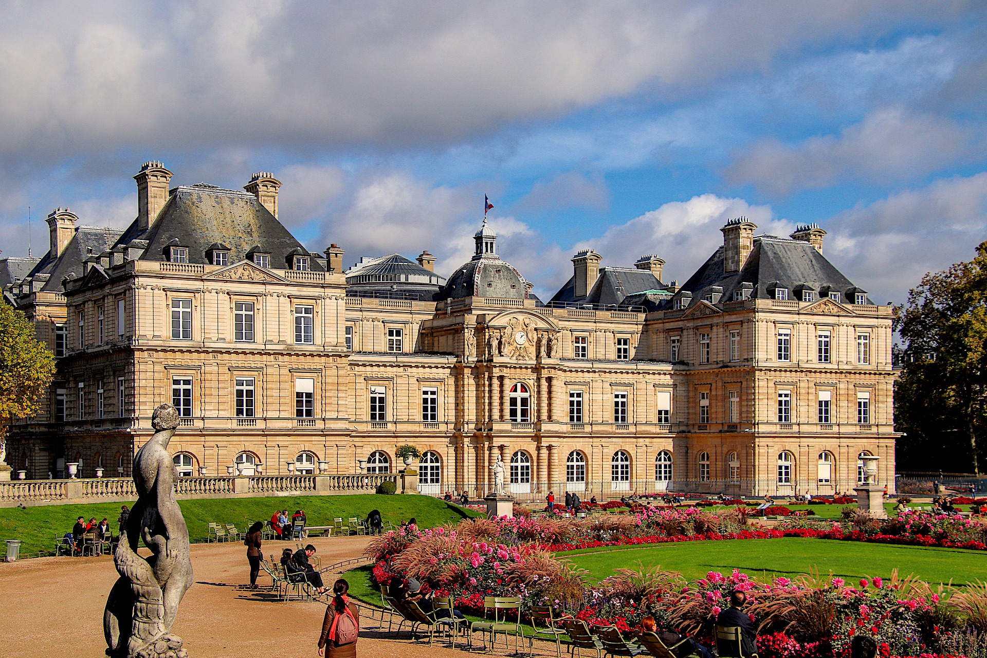 An old building surrounded by gardens in Paris beautiful city parks