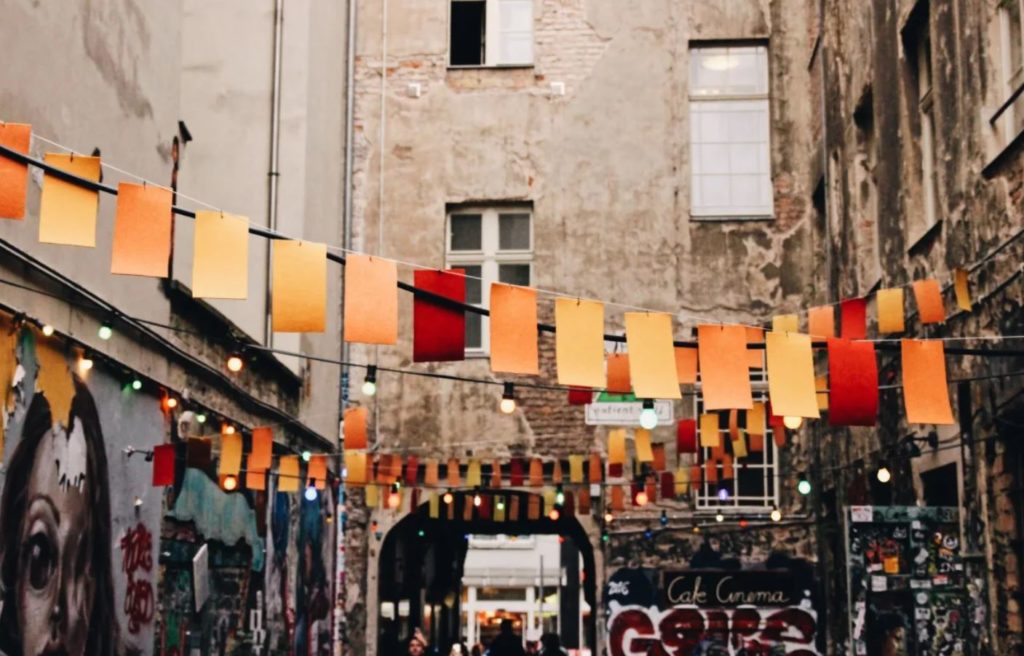 Fairy lights and flags in an alley in Berlin travel destinations for students in germany