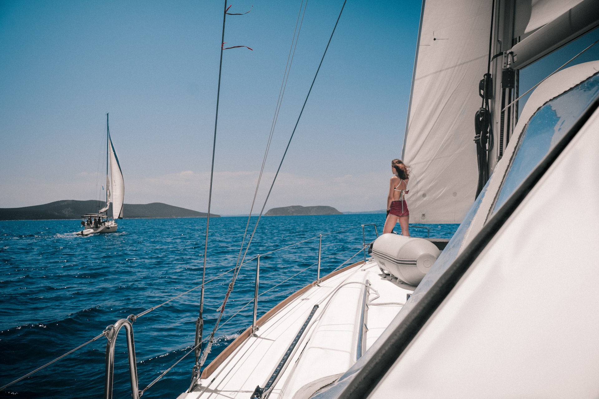 sail on a catamaran around Santorini and stop by must-see places
