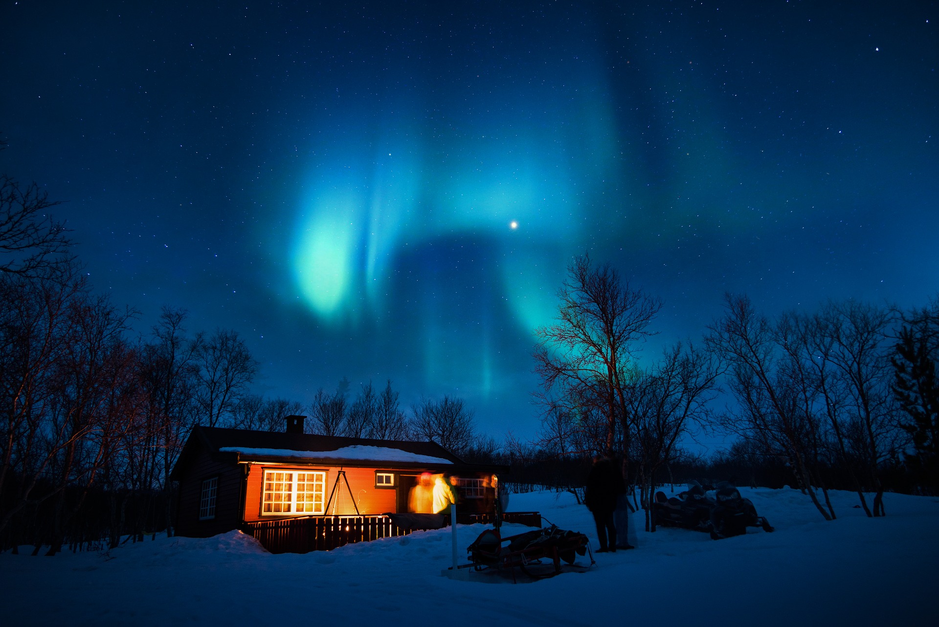 Cabin with northern lights overhead