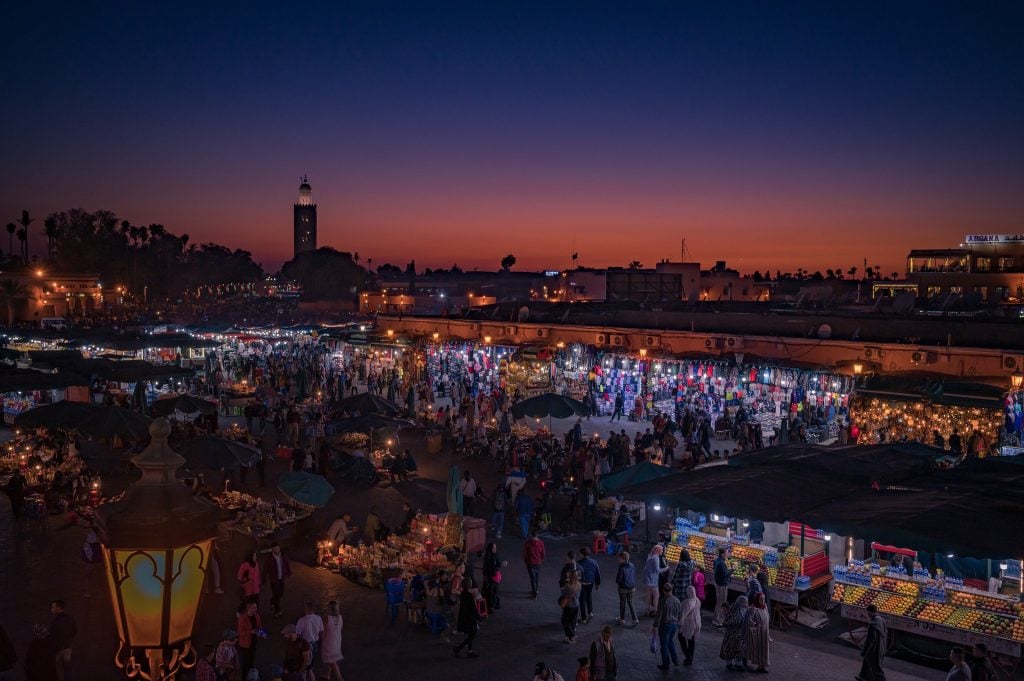 The Jamaa el-Fna square in Marrakech at sunset is a highlight on our Morocco travel guide