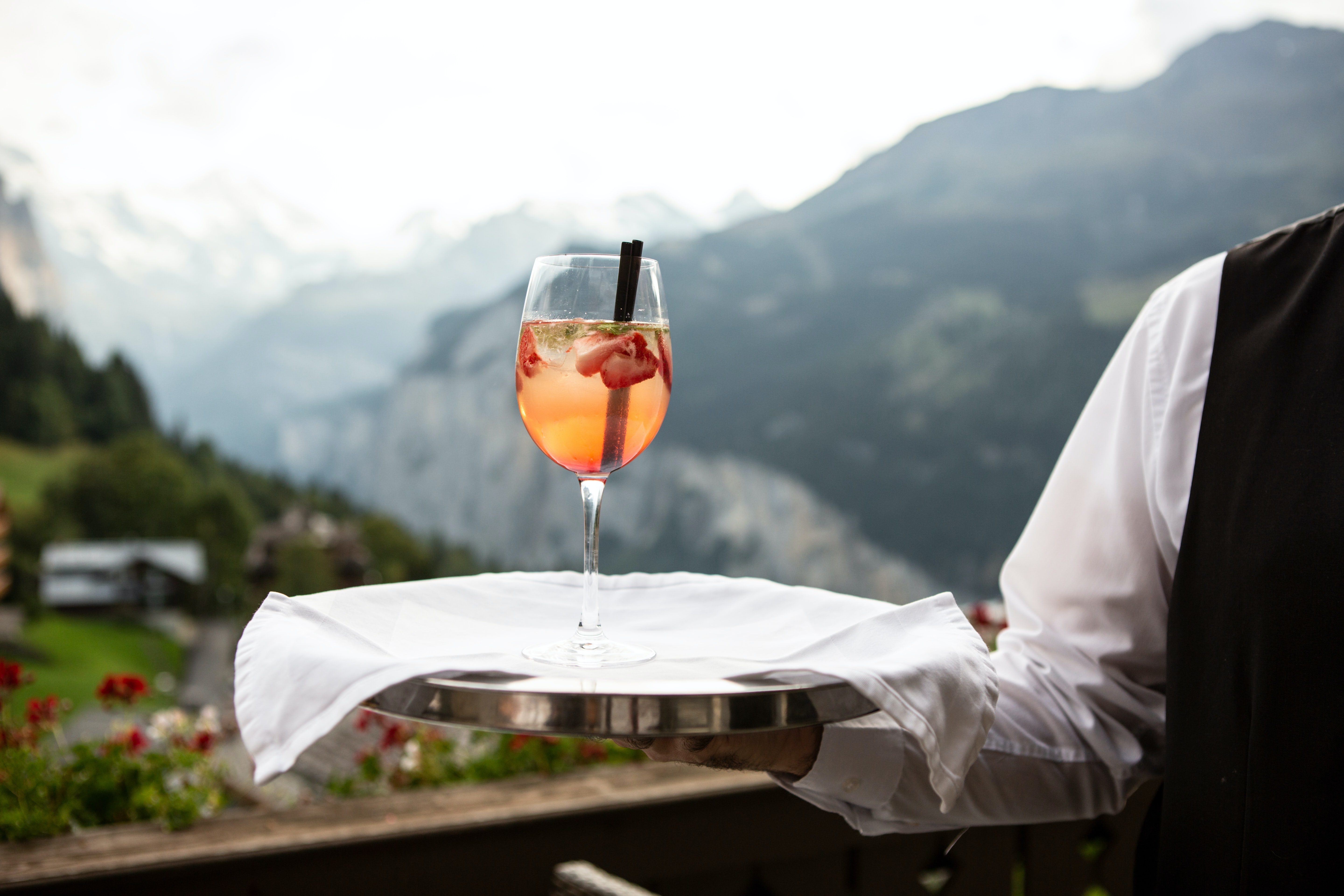 A cocktail with mountains in the back