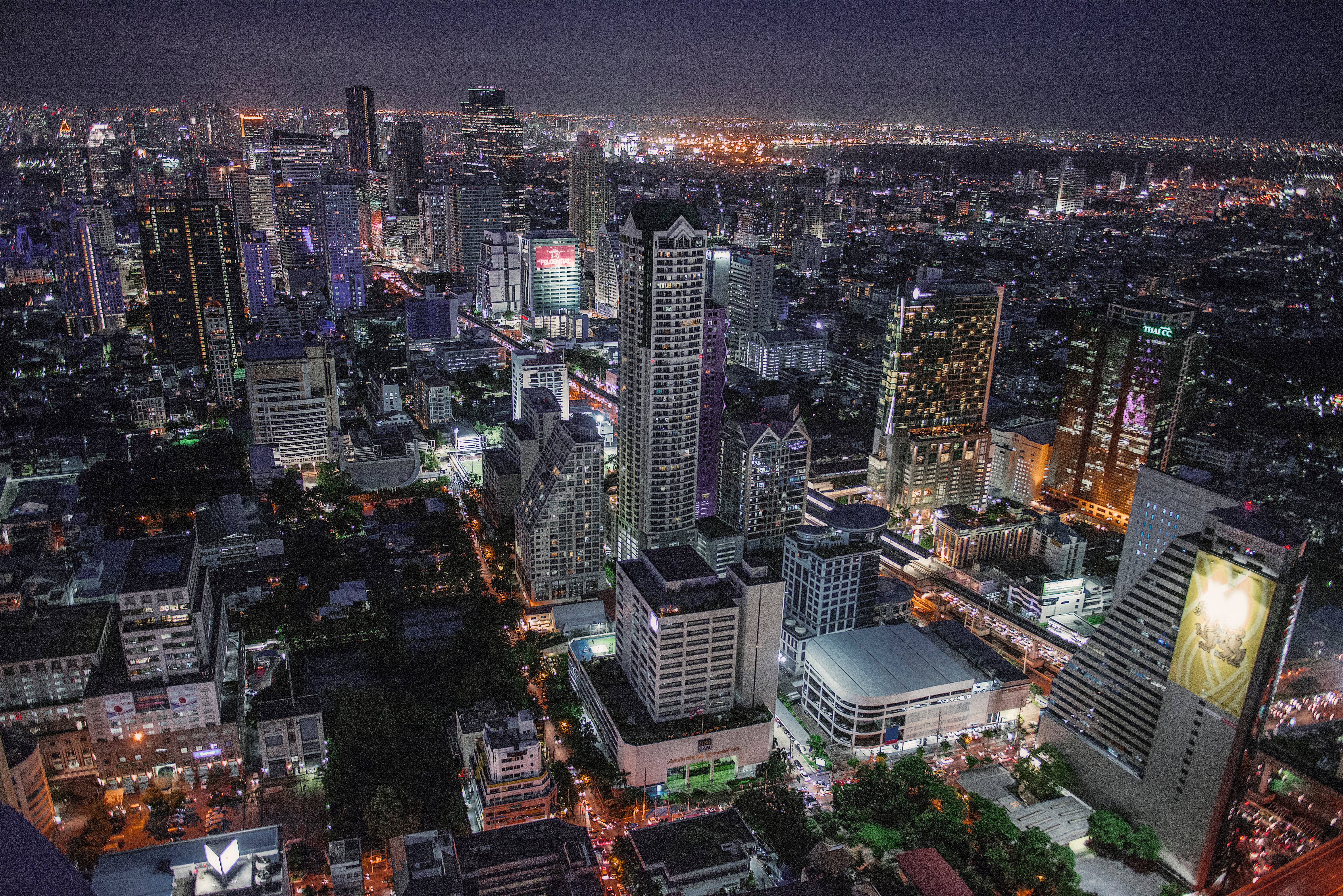 The city of Bangkok at nightfall with skyscrapers and lights