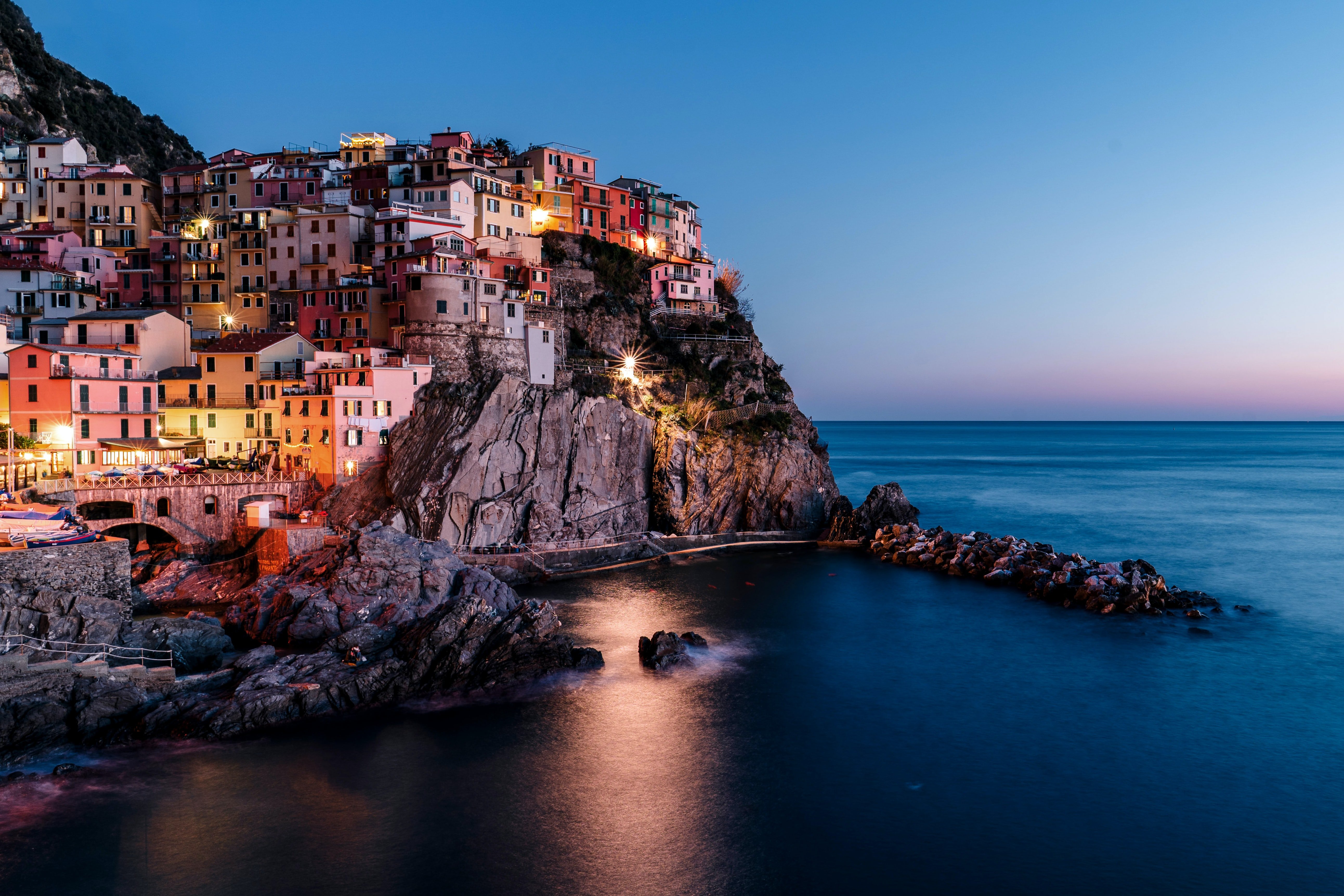 A colorful city on the coast of Italy in the evening