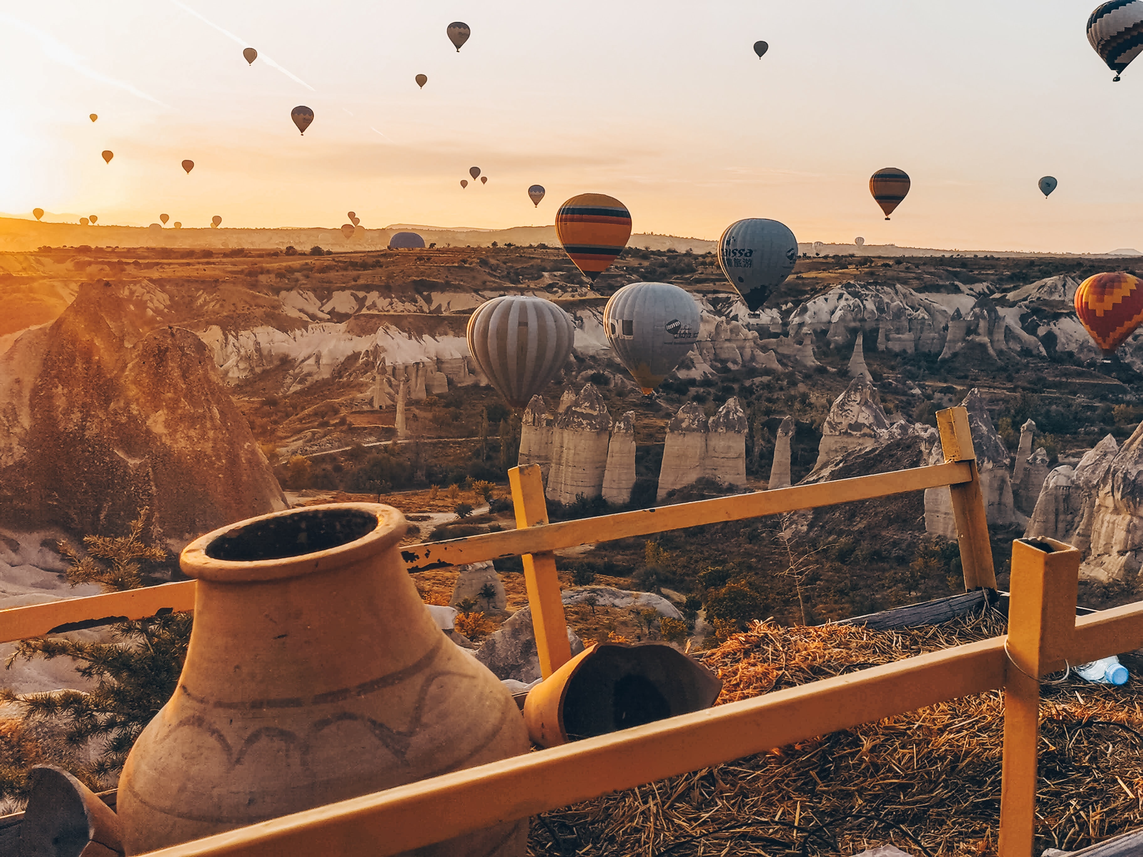 Hot air balloons in the rocky landscapes of Cappadocia in the morning
