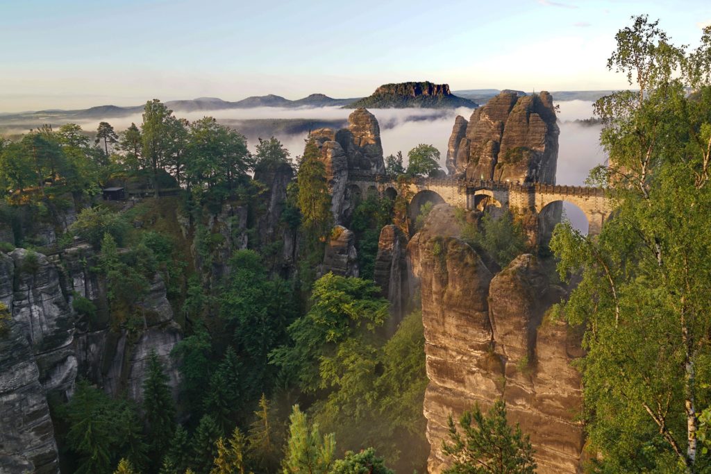 The Bastei Bridge surrounded by huge mountains